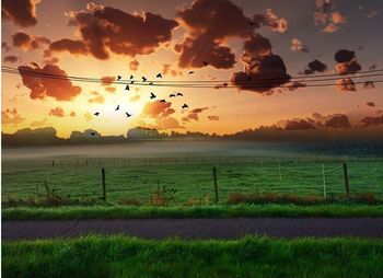 Scenic view of landscape against dramatic sky