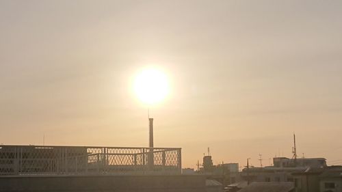 Buildings against sky during sunset