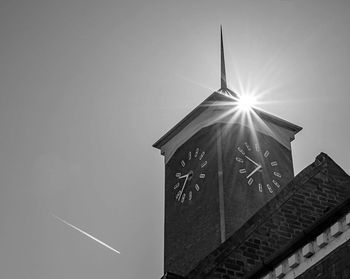 Low angle view of clock tower against sky