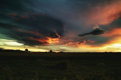 Scenic view of landscape against cloudy sky