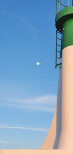 Low angle view of tower against blue sky