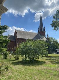 Plants growing on field against building