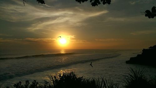 Scenic view of sea against sky during sunset