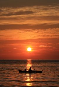 Scenic view of sea at sunset