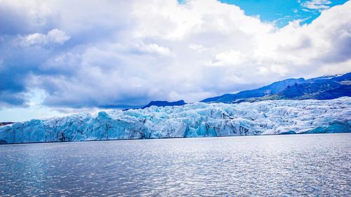 Scenic view of frozen lake against sky