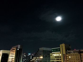 Low angle view of illuminated buildings at night