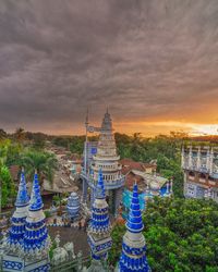 Panoramic view of buildings against sky during sunset