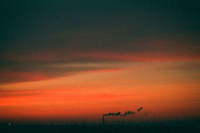 Scenic view of silhouette landscape against sky at night