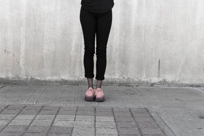 Low section of woman standing on floor