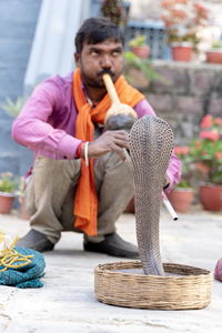 Low angle view of man standing on table