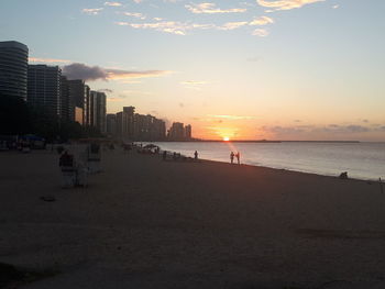 Scenic view of beach against sky during sunset