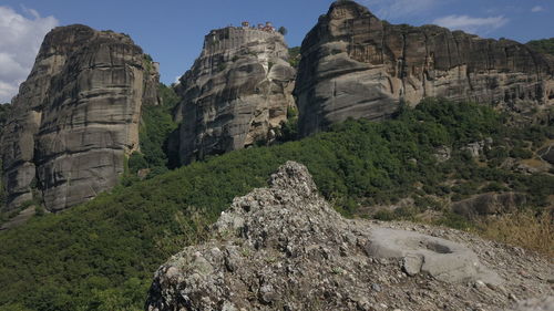 Rock formations on landscape against sky