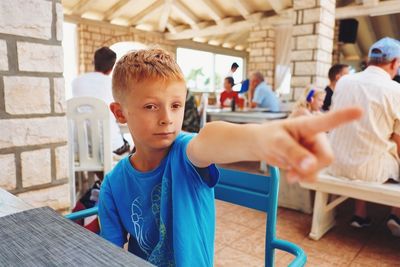 Boy sitting at restaurant