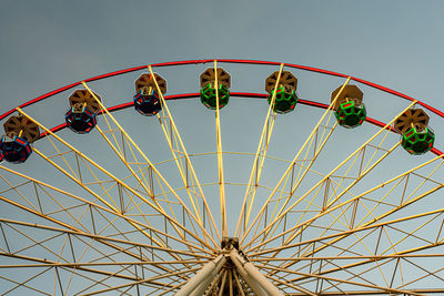 View of a ferris wheel in bayonne during a beautiful sunset