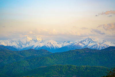 Scenic view of snowcapped mountains against sky