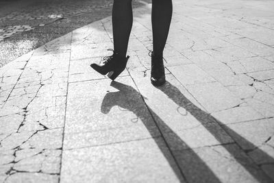 Low section of woman standing on floor