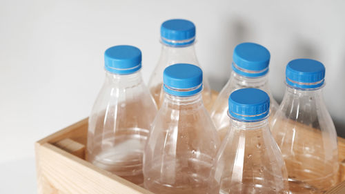 Close-up of glass bottle against white background