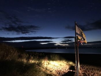 Scenic view of sea against sky at night