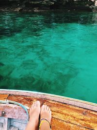 Low section of woman in boat on river