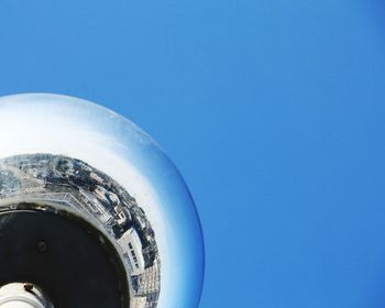 Low angle view of buildings against clear blue sky