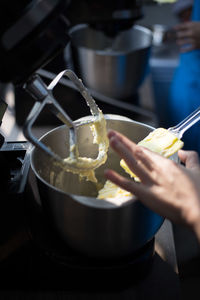 Cropped image of woman baking in kitchen