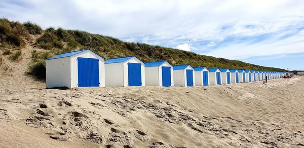 Beach huts against sky