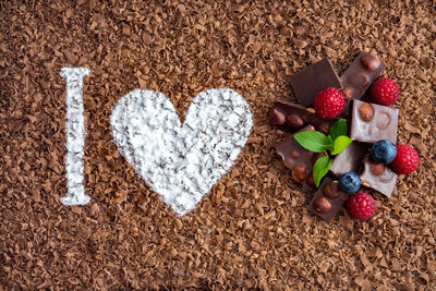 Directly above shot of i love you text on chocolate shavings