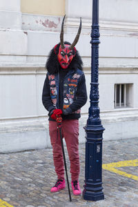 Switzerland, basel, 7 march 22. single carnival participant wearing a devils mask