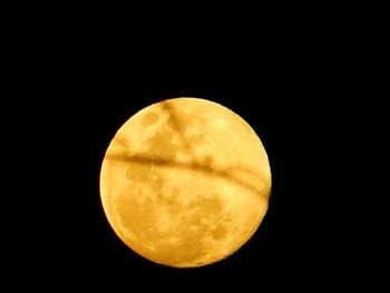 Low angle view of moon against clear sky at night