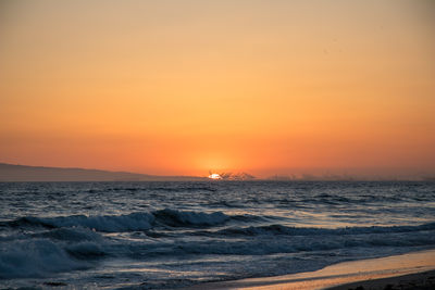 Scenic view of sea against sky during sunset