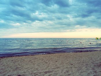 Scenic view of sea against cloudy sky