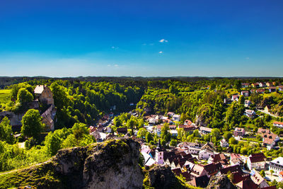 High angle view of townscape against blue sky