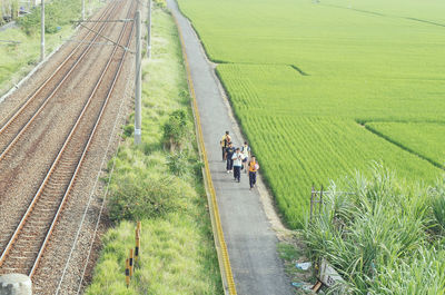 People walking on railroad track