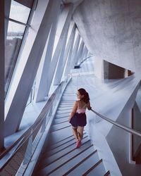 Woman walking on staircase