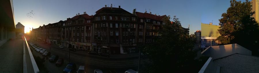 Buildings against sky at sunset