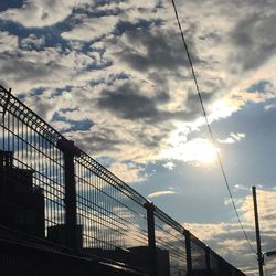 Low angle view of bridge against sky in city