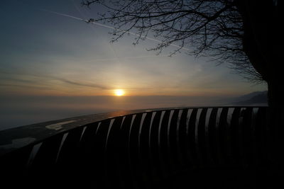 Scenic view of sunset over silhouette trees