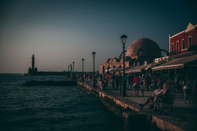 Group of people in city at waterfront