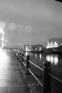 View of illuminated bridge over sea