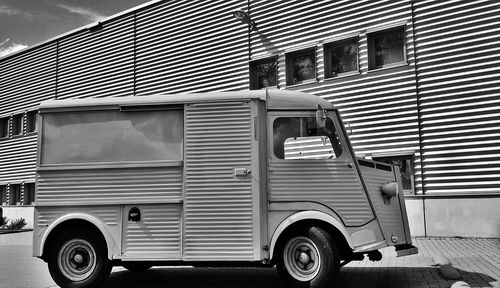 Truck parked outside building on street