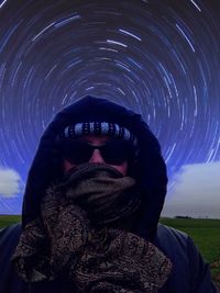 Portrait of woman against sky during winter at night