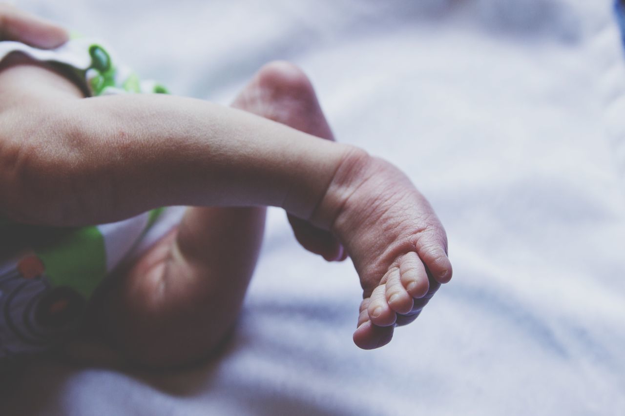 human body part, human hand, baby, close-up, babyhood, human finger, barefoot, one person, real people, childhood, human skin, low section, day, outdoors, adult, people