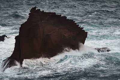 Scenic view of sea waves splashing on rocks