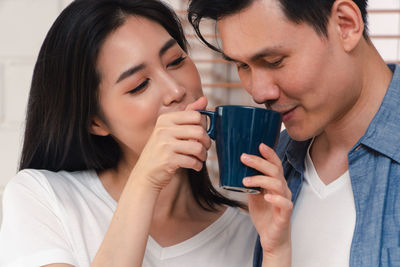 Portrait of a woman drinking water