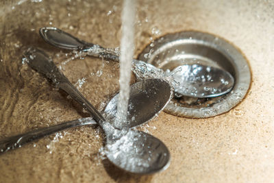 High angle view of water in container on table