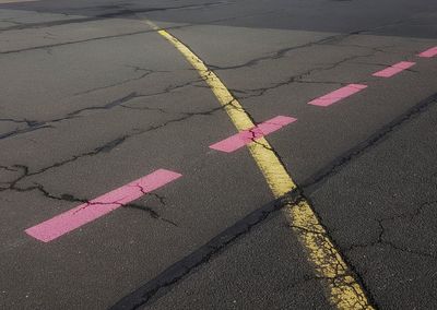 High angle view of arrow sign on road