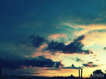 Low angle view of cloudy sky at sunset