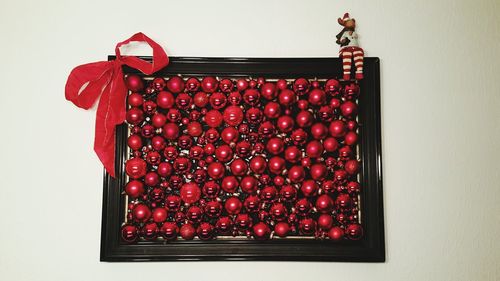Close-up of picture frame made of baubles