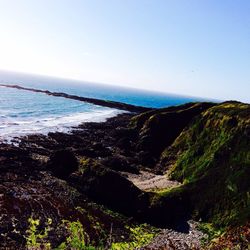 Scenic view of sea against blue sky