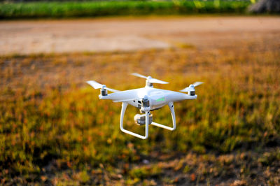 Drone flying over field